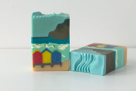 Two soap bars with artistic designs on a white background