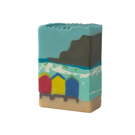 Bar of soap with beach hut design on a white background