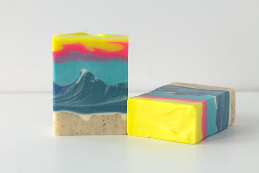 Two colorful ocean inspired soap bars on a white background