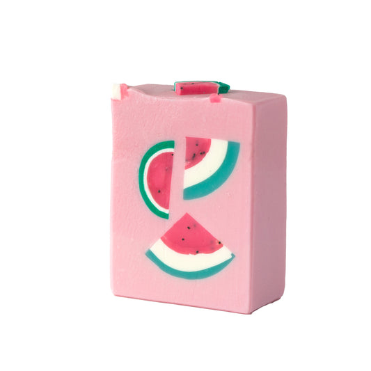 Pink soap bar with watermelon design on a white background