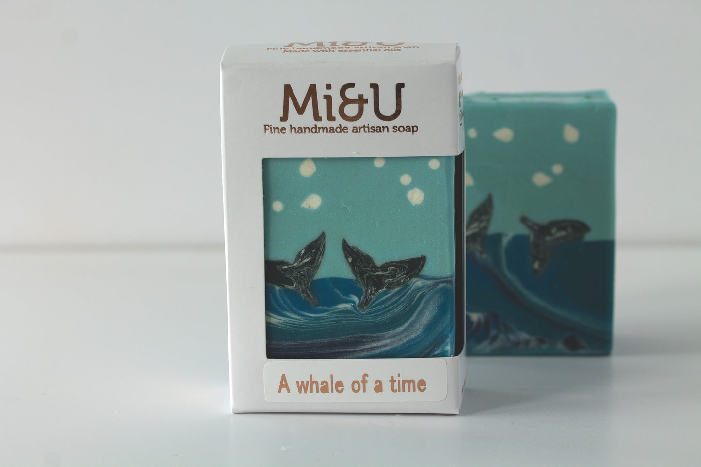 Mi&U soap packaging with whale design on a white background