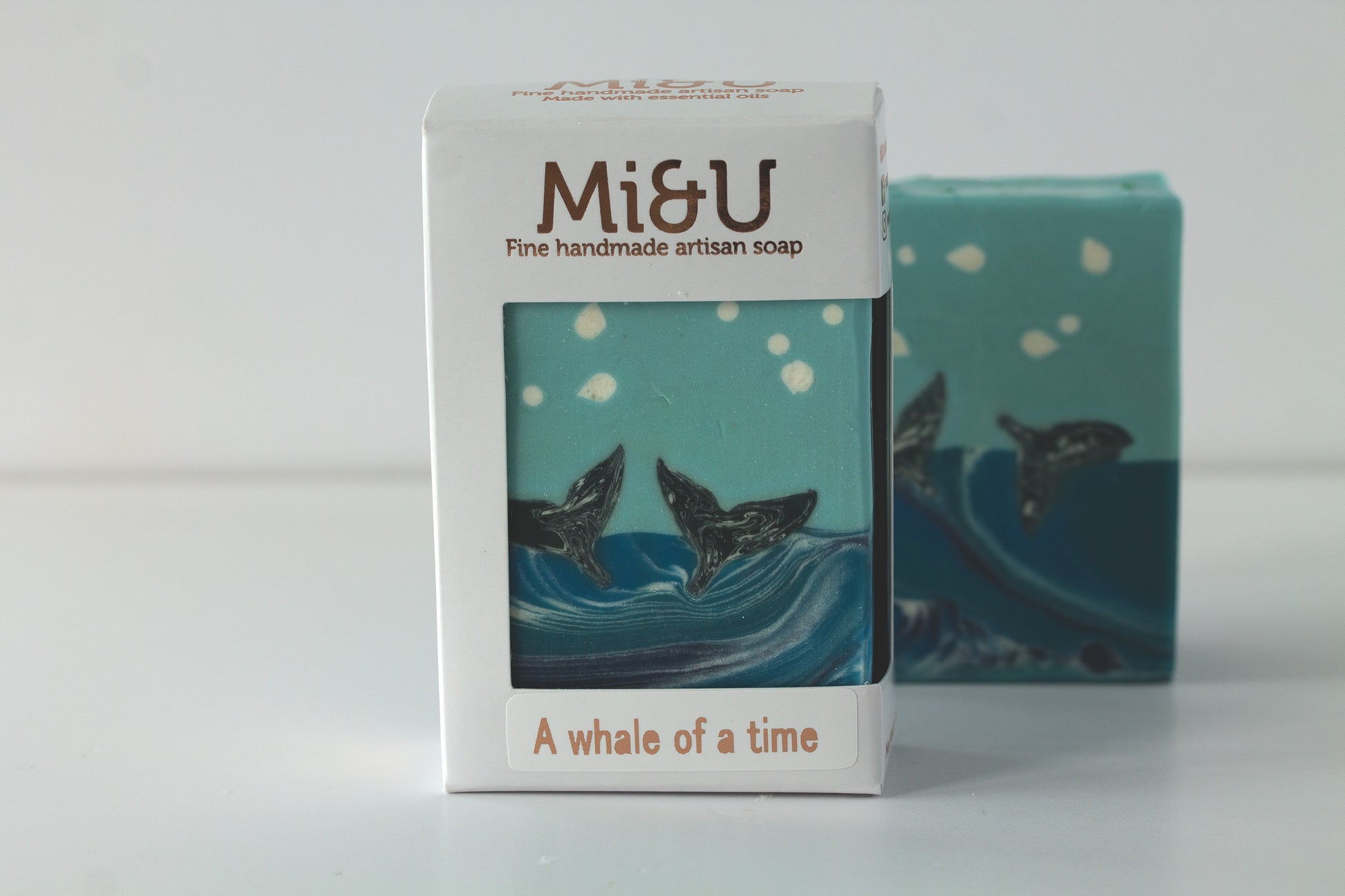 Mi&U soap packaging with whale design on a white background