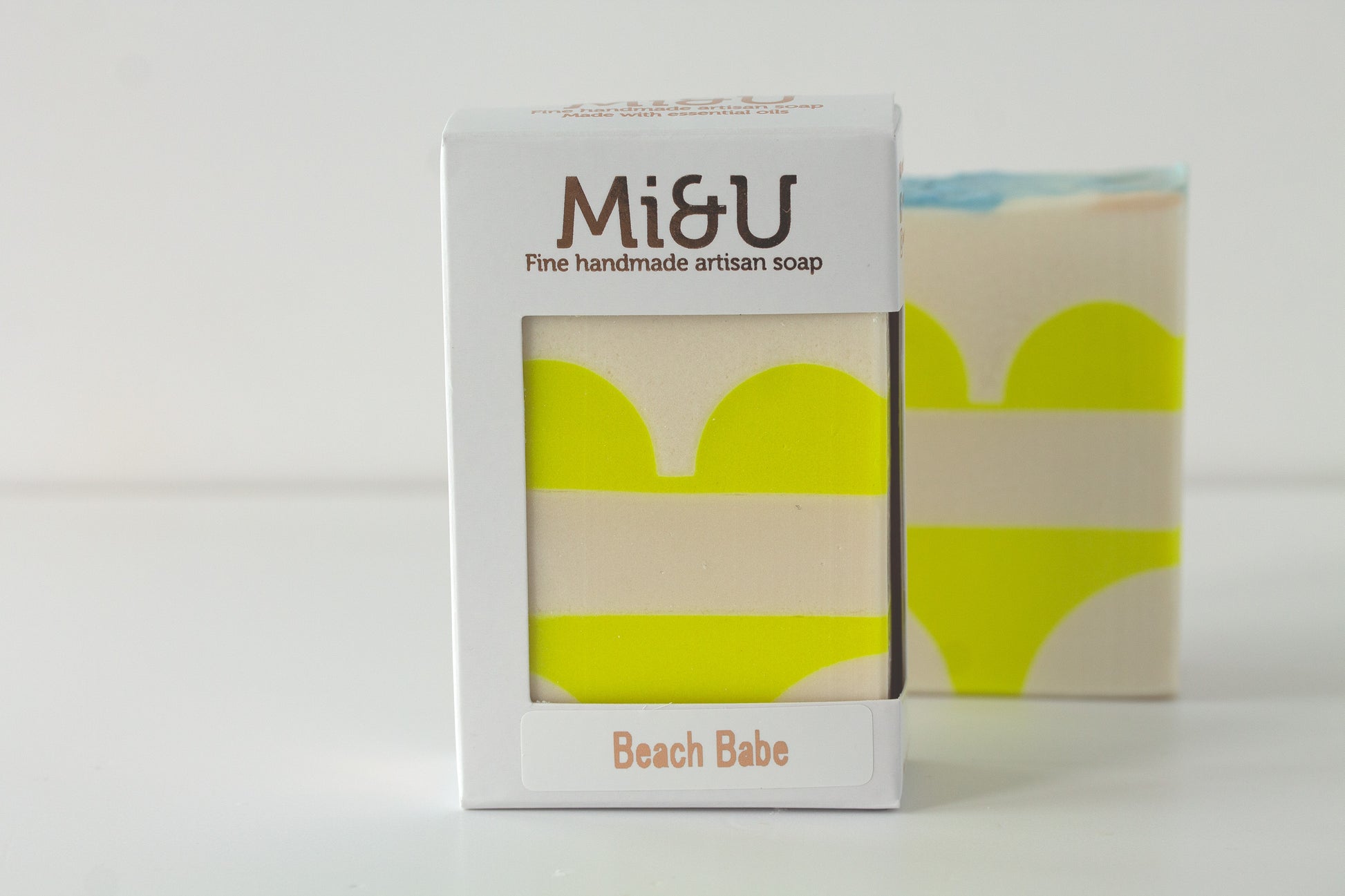 Mi&U handmade artisan soap packaging with a yellow and beige bikini design on a white background