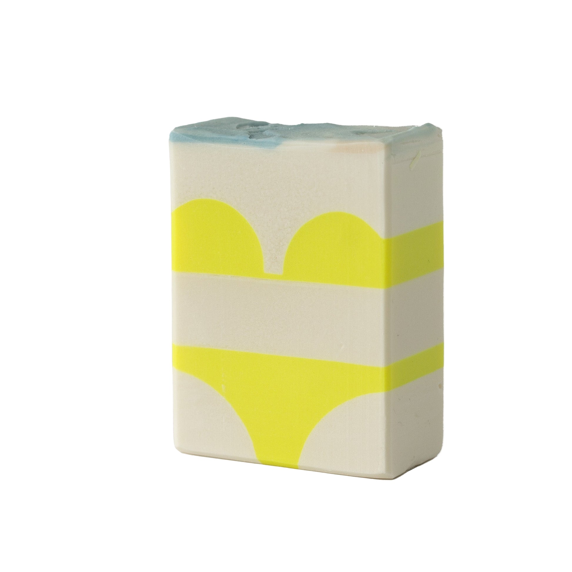 A yellow bikini detail in a soap bar on a white background