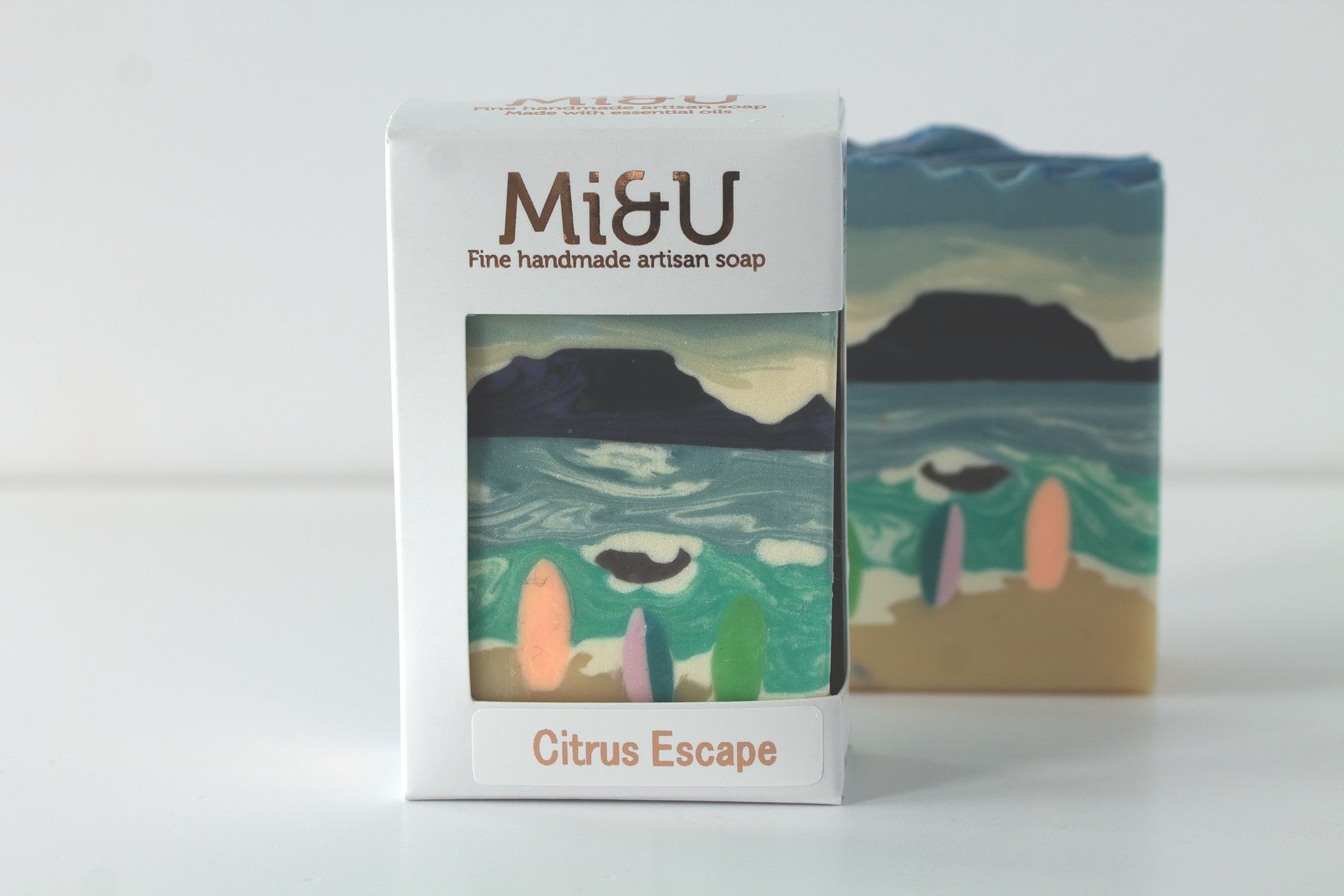 Mi&U handmade artisan soap with packaging featuring a beach scene design.