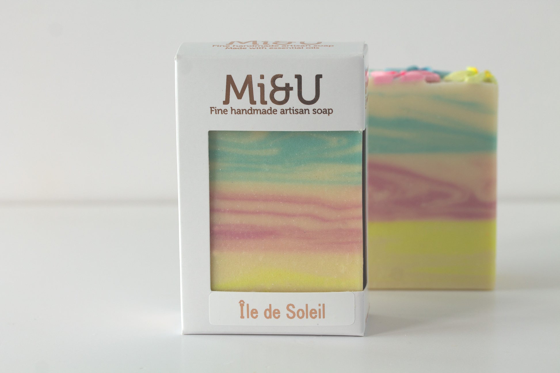 Tropical floral  soap bar with in a Mi&U Soap carton  on a white background