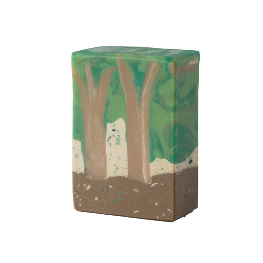 Bar of soap with natural forest design on a white background