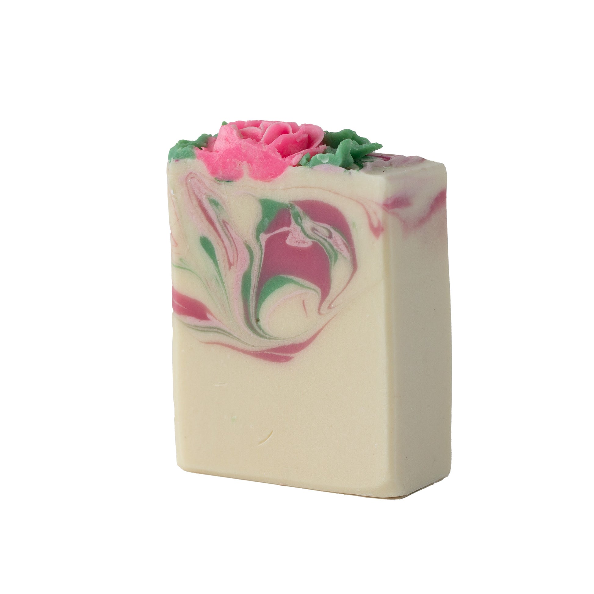Bar of soap with pink and green swirls and a pink flower on top against a white background