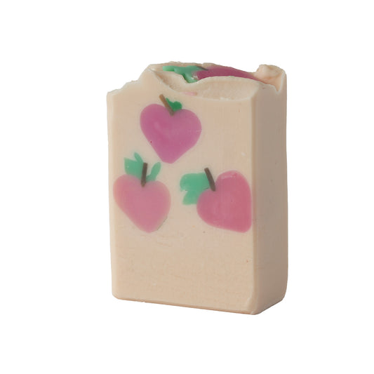 Rectangular soap bar with pink peach 
designs on a white background
