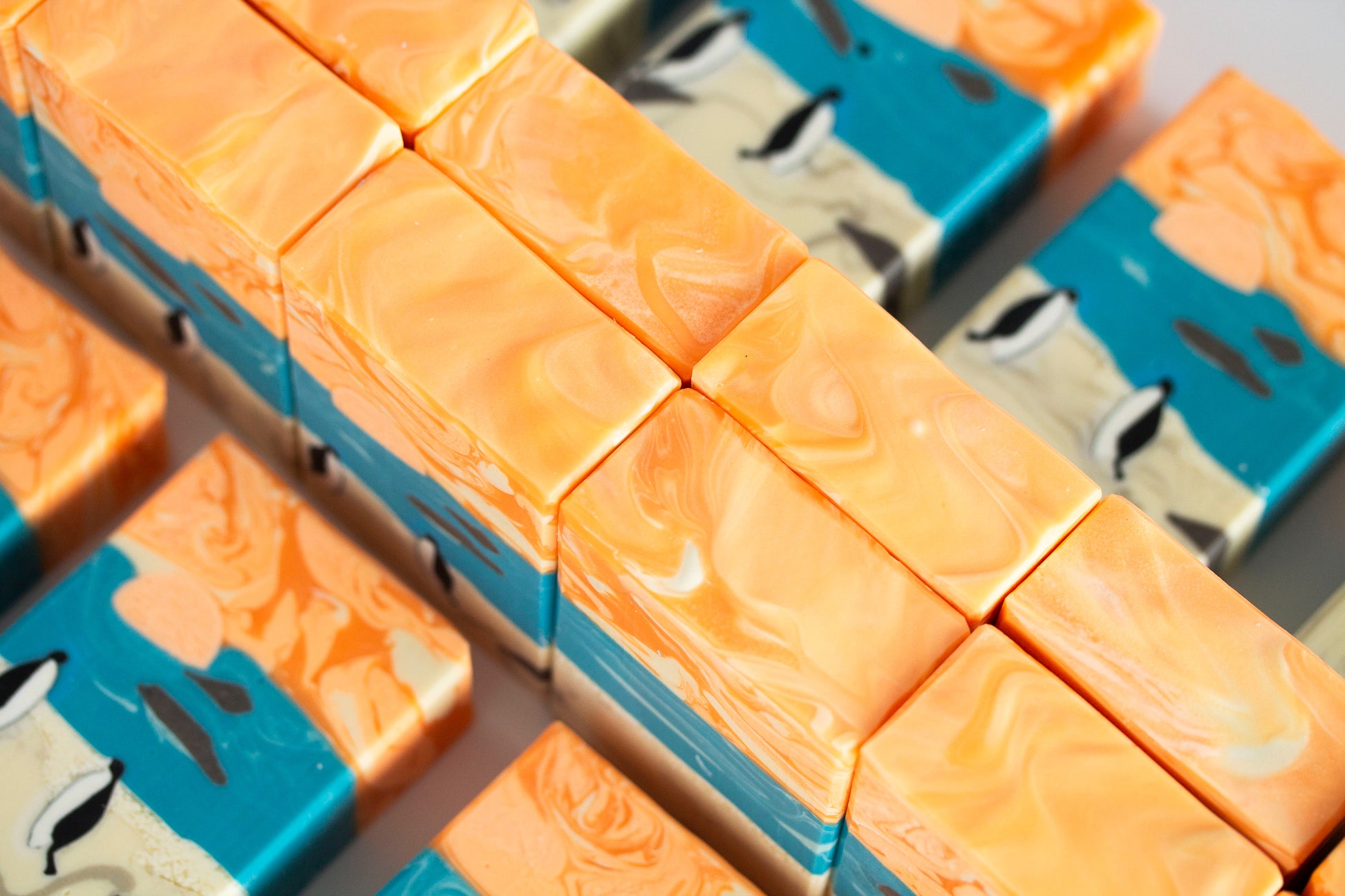Close-up of orange soap bars on a white background