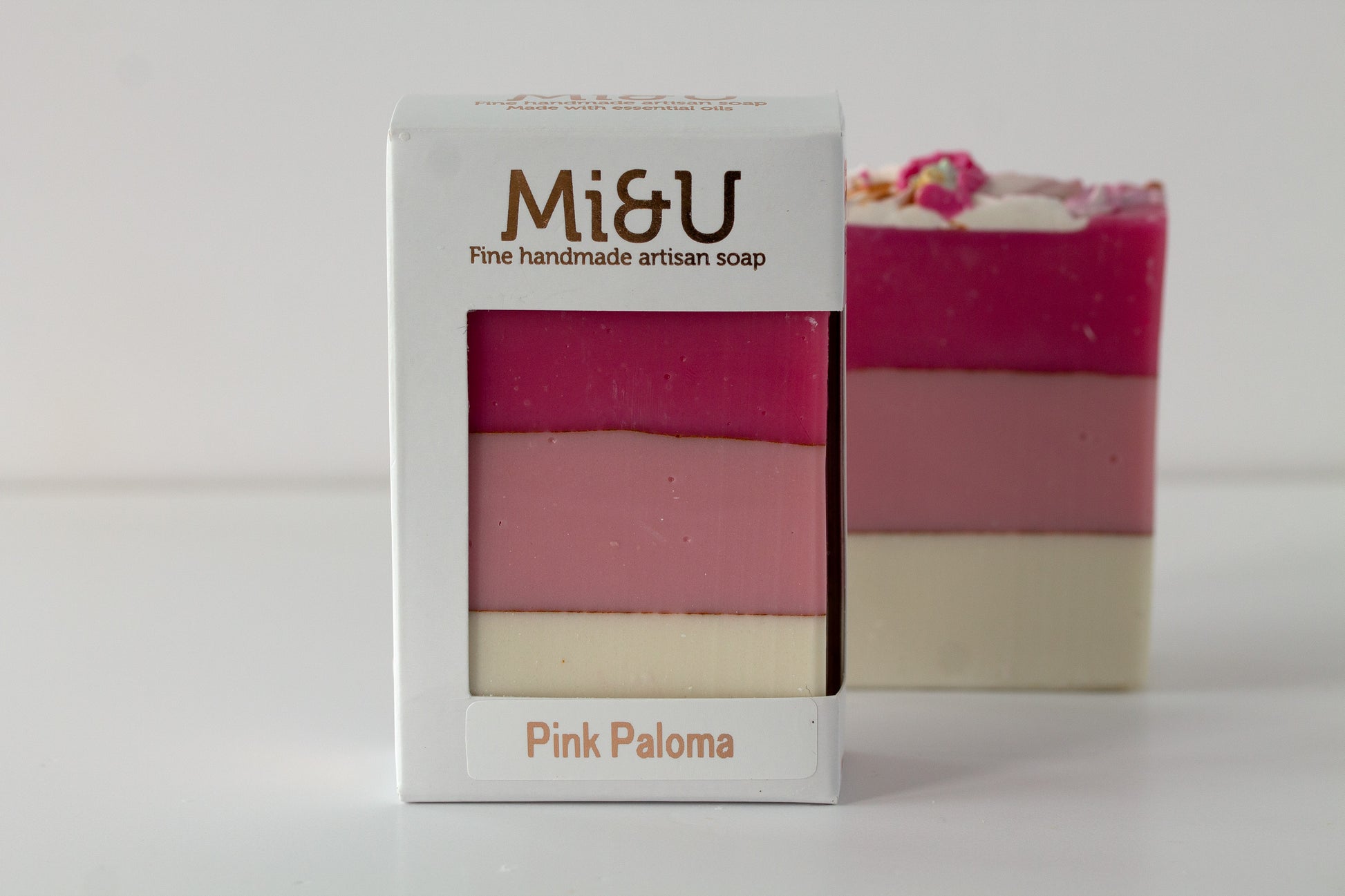 Mi&U Pink Paloma soap with packaging on a light gray background