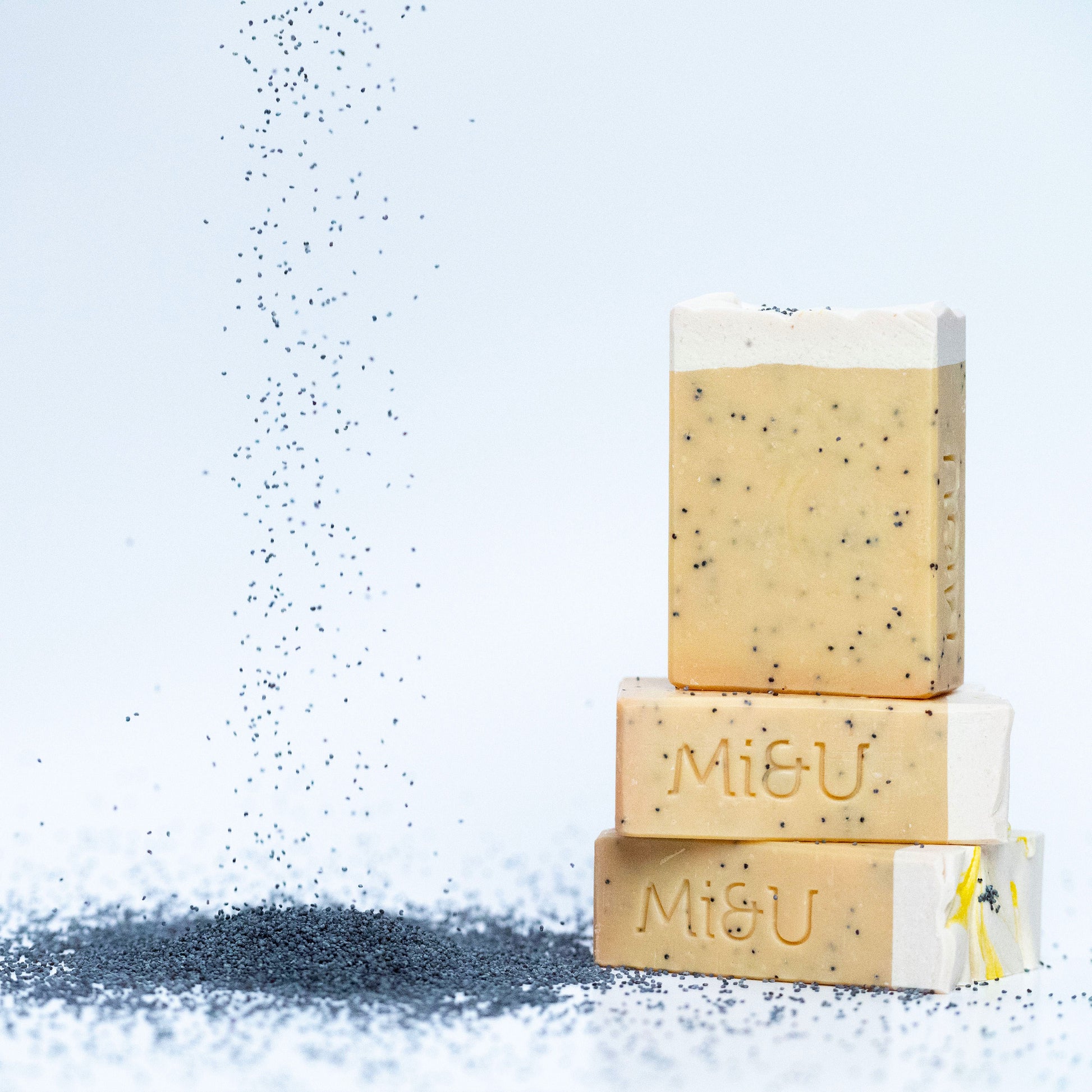 Poppy-seeds-falling-into-lemon-bar-soap