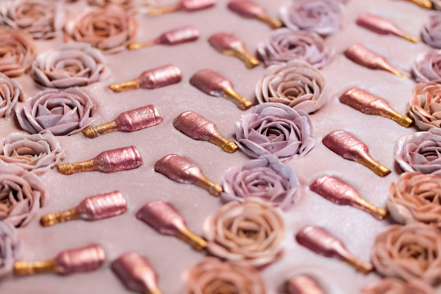 Soap loaf top with roses' gold champagne bottles on a light background