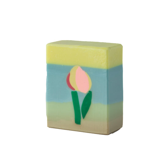 Bar of soap with a tulip design on a white background