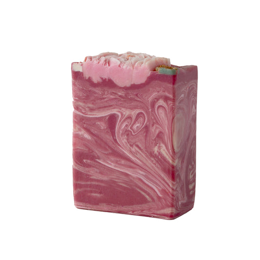 Marbled pink and white soap bar wiht hand piped peonies on a white background