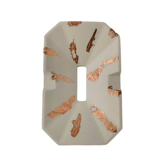 Decorative soap dish with a geometric shape on a white background