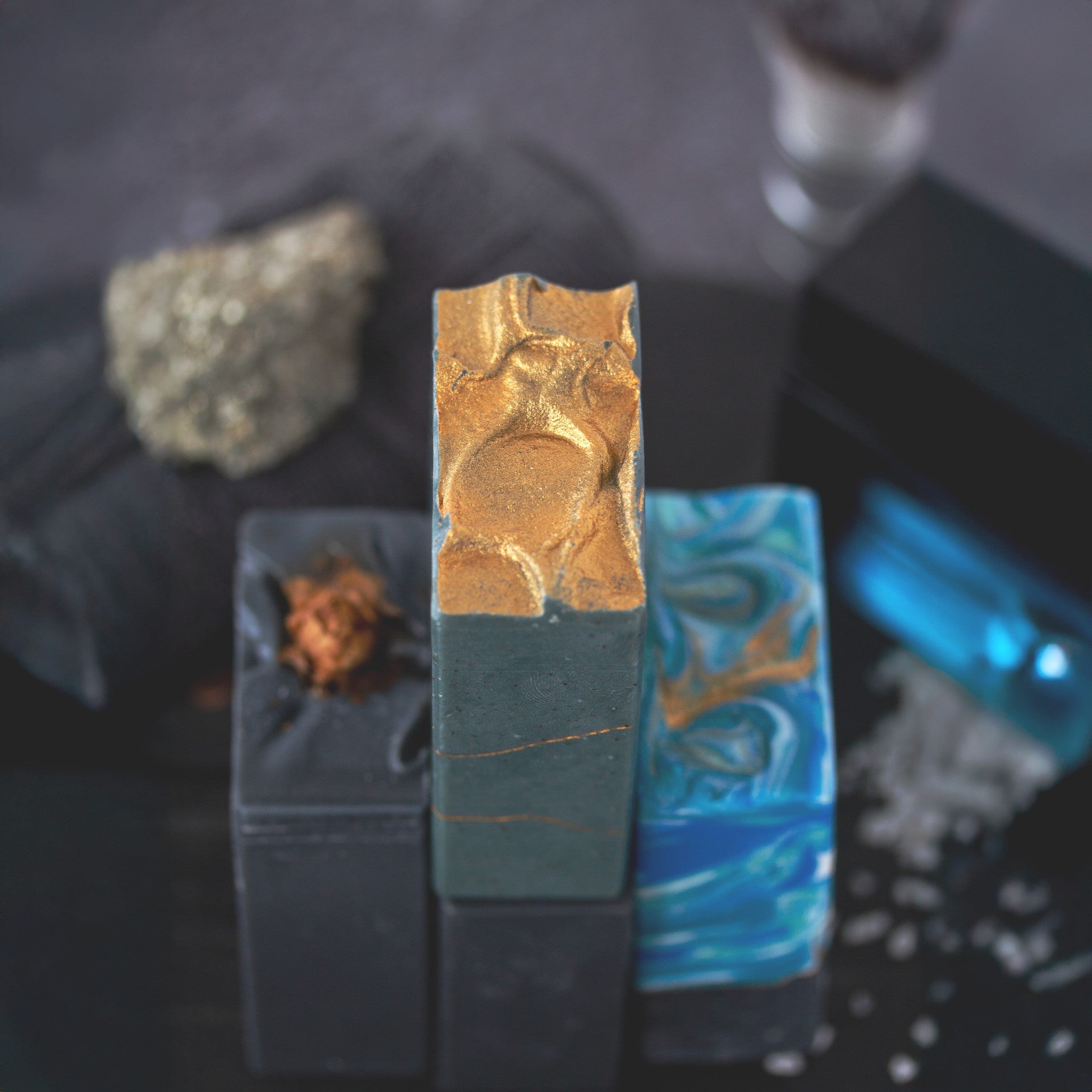 Close-up of three artisan soap bars with gold texture and ocean swirls — part of The Well Kept Man Father's Day gift set by Mi&U Soap