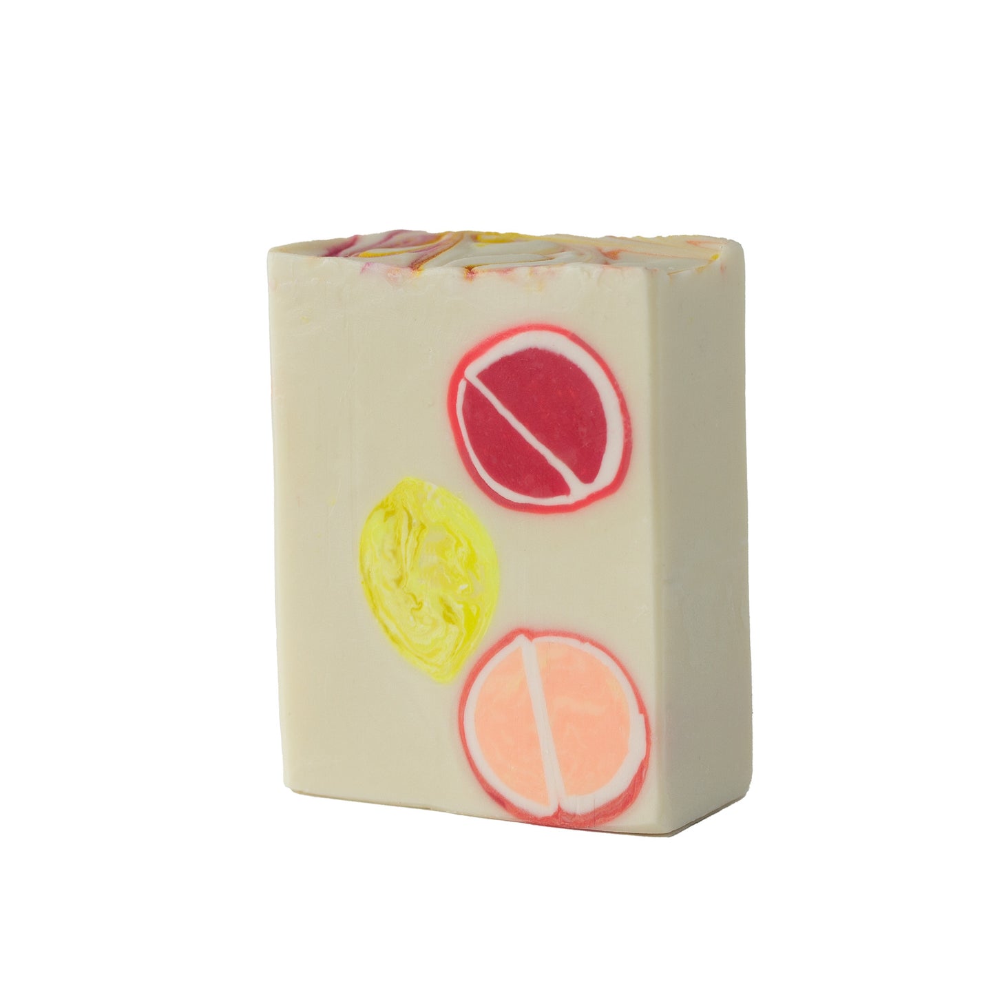 Creamy soap bar with embedded citrus fruits